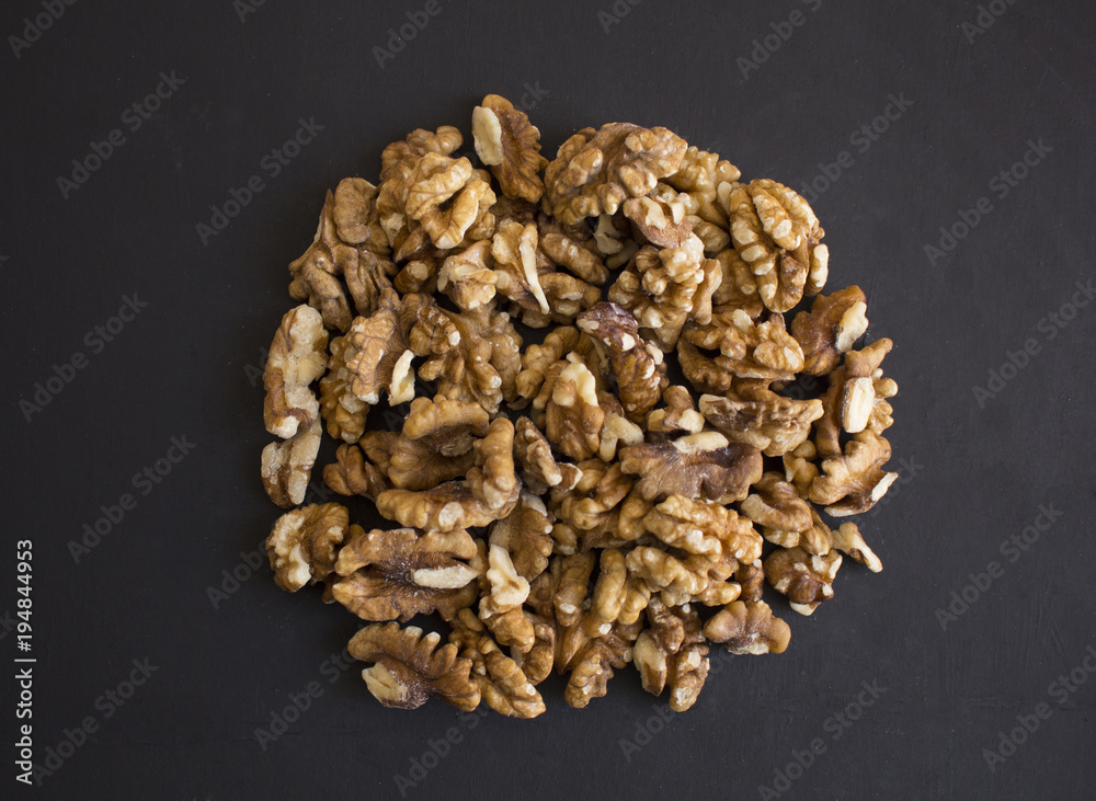 Walnuts on a black background Walnuts on a black background