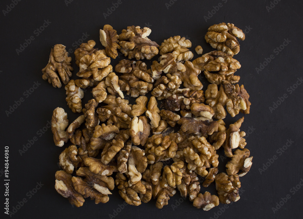 Walnuts on a black background