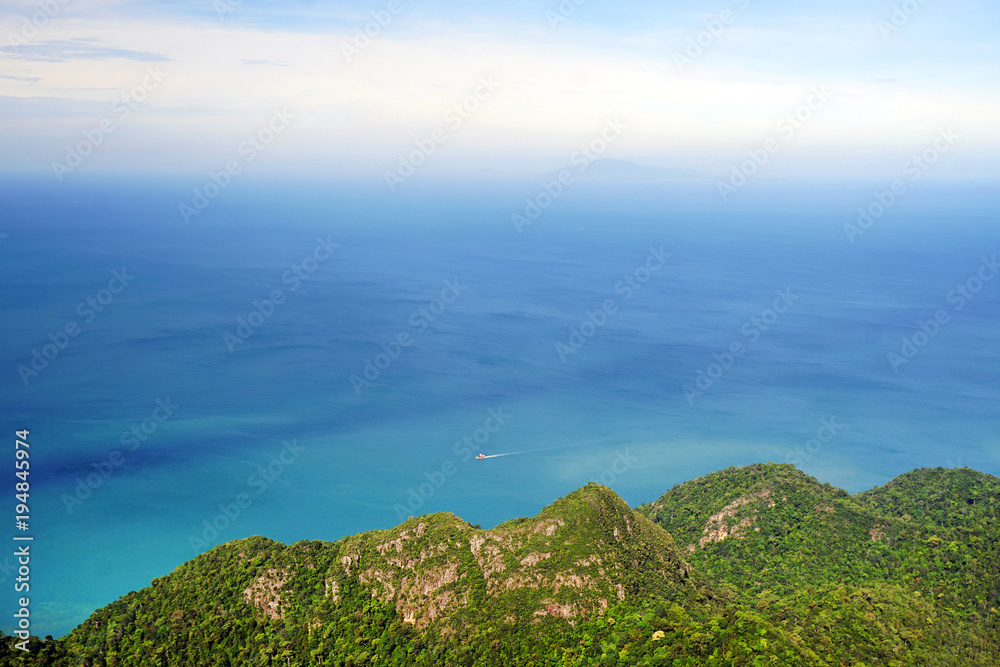 Panoramic view of blue sky sea and mountain seen from Cable Car viewpoint, Langkawi, Malaysia. Picturesque landscape with tropical forest in waters of Strait of Malacca