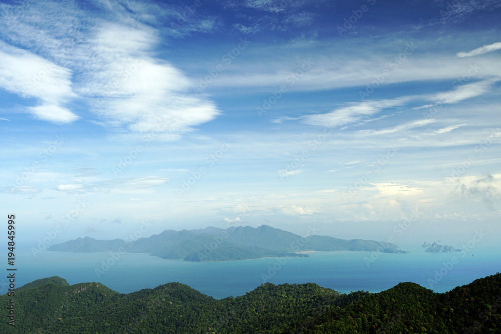 Panoramic view of blue sky sea and mountain seen from Cable Car viewpoint, Langkawi, Malaysia. Picturesque landscape with tropical forest in waters of Strait of Malacca Panoramic view of blue sky sea and mountain seen from Cable Car viewpoint, Langkawi, Malaysia. Picturesque landscape with tropical forest in waters of Strait of Malacca