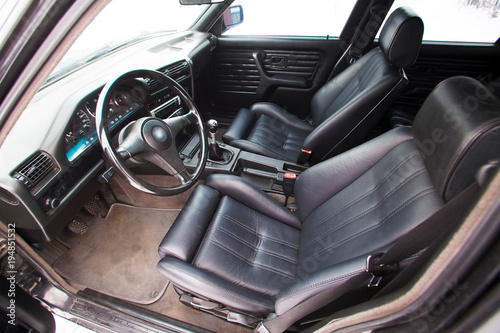 Black leather front seats of retro car