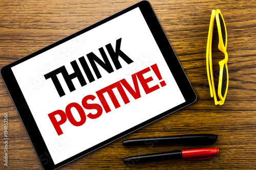 Writing text showing Think Positive. Business concept for Positivity Attitude Written on tablet laptop, wooden background with vacation yellow glasses and marker pen.