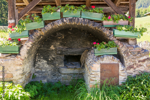 detail of the wooden house typical in a alps village on Ridnaun Valley/Ridanna Valley - Racines country - near Sterzing/Vipiteno, South Tyrol, northern italy photo