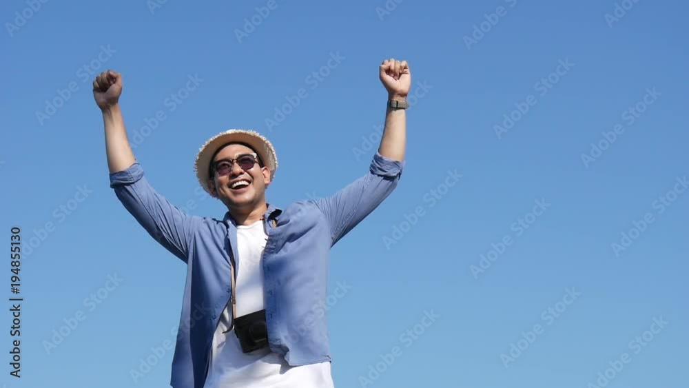 A carefree and free boy raised his hands and looked at the sky, slow A carefree and free boy raised his hands and looked at the sky, slow