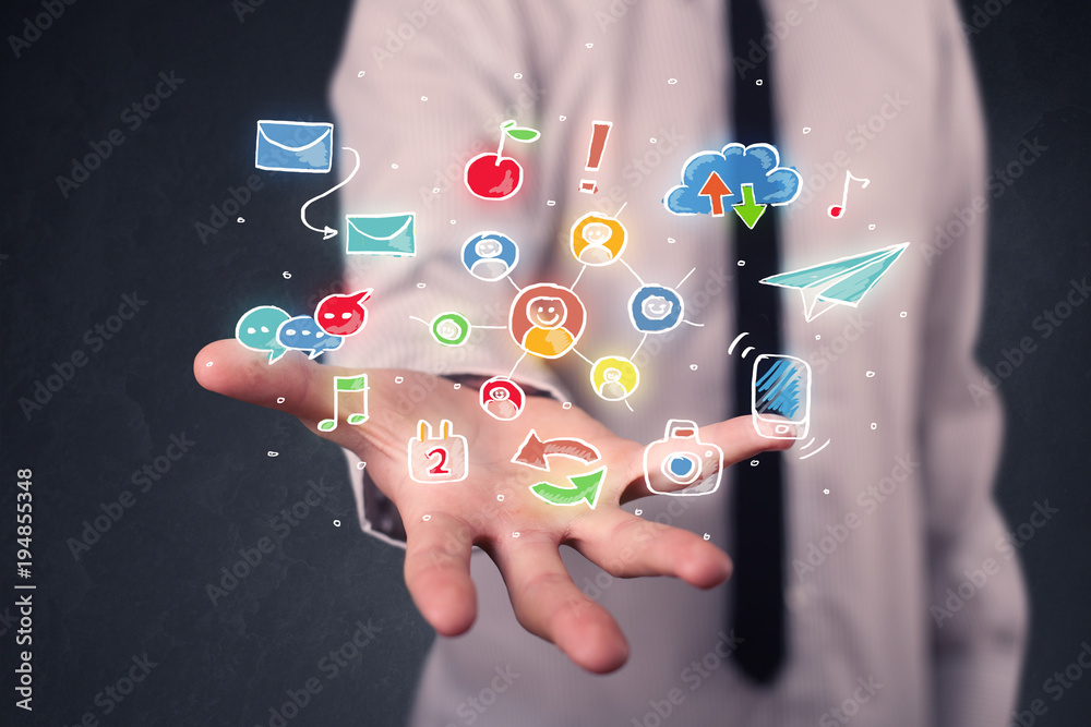 Businessman holding colorful applications Businessman holding colorful applications