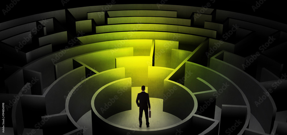 Businessman choosing between entrances in a middle of a dark maze