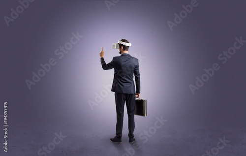 Businessman in an empty room with vr glasses