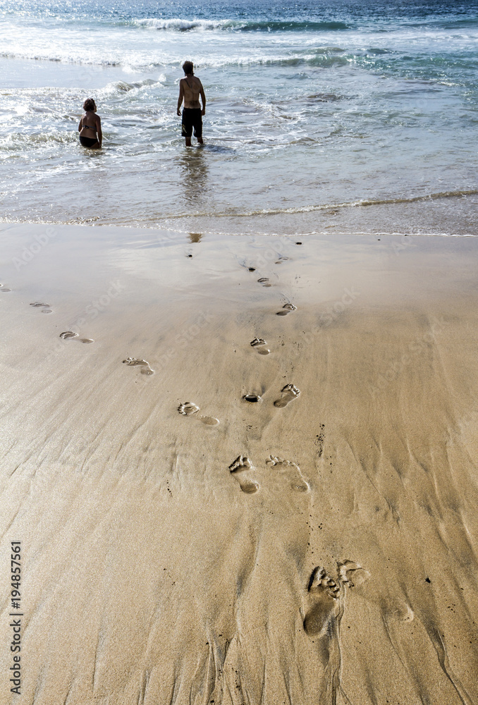 man and woman footprint on the beach