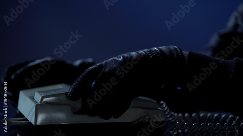 Canvas Print Unidentified man puts handset after calling to blackmail victim, demands money
