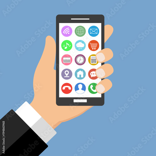 mobile phone in hand with attachments on a blue background