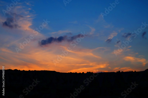 Nice twilight sky during sunset on the silhouette of mountain ridge