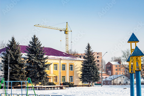 urban view with  new building and  crane, construction and sale of apartments