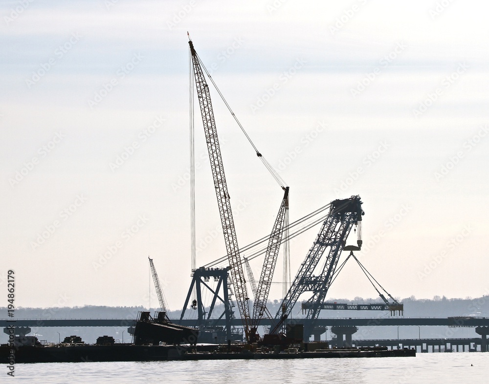 Cranes Working on Bridge