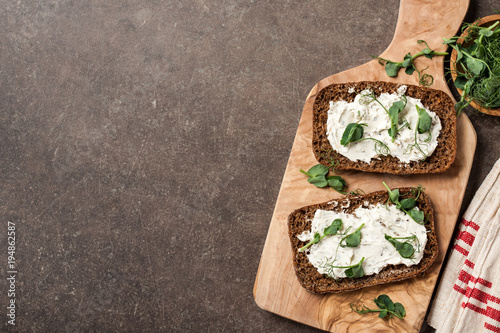 Rye bread with cheese cream and pea sprouts