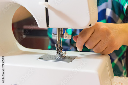 Woman preparing the sewing machine