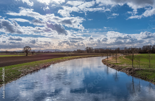 Fototapeta Naklejka Na Ścianę i Meble -  The landscape of a river in sunlight
