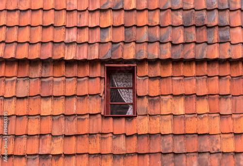 The window in an old tile roof