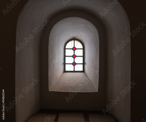The old and ancient window in dark room