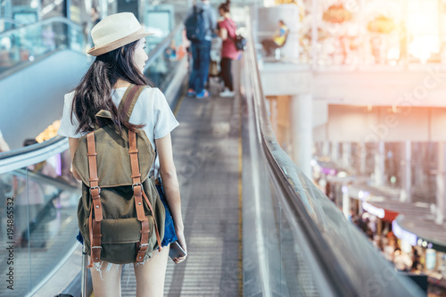 Young Asian is passenger at the international airport.