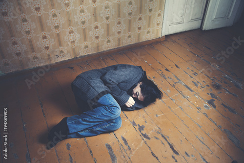 The depression woman lying on the floor