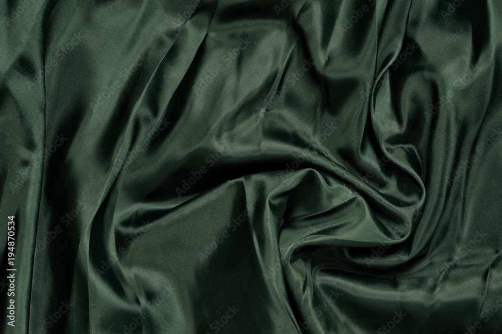 Fototapeta premium Smooth elegant green silk or satin luxury cloth texture. Retro style.