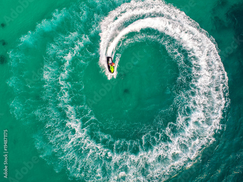 People are playing jet ski at sea during the holidays. © MAGNIFIER