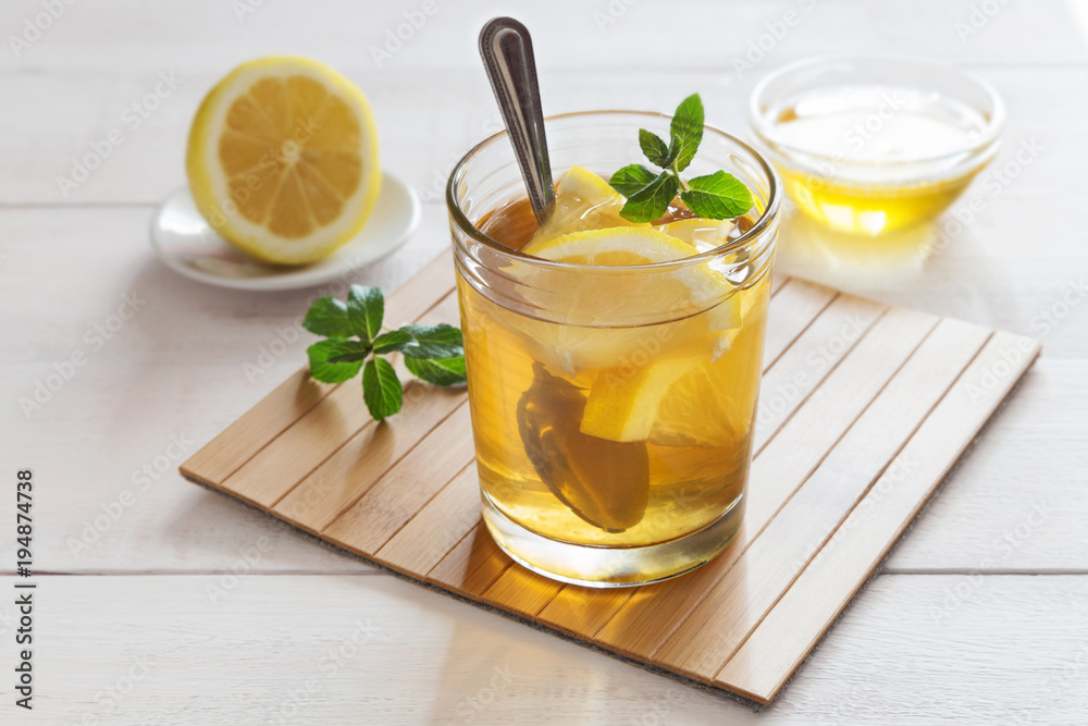 Fototapeta premium Glass of mint lemon tea and honey