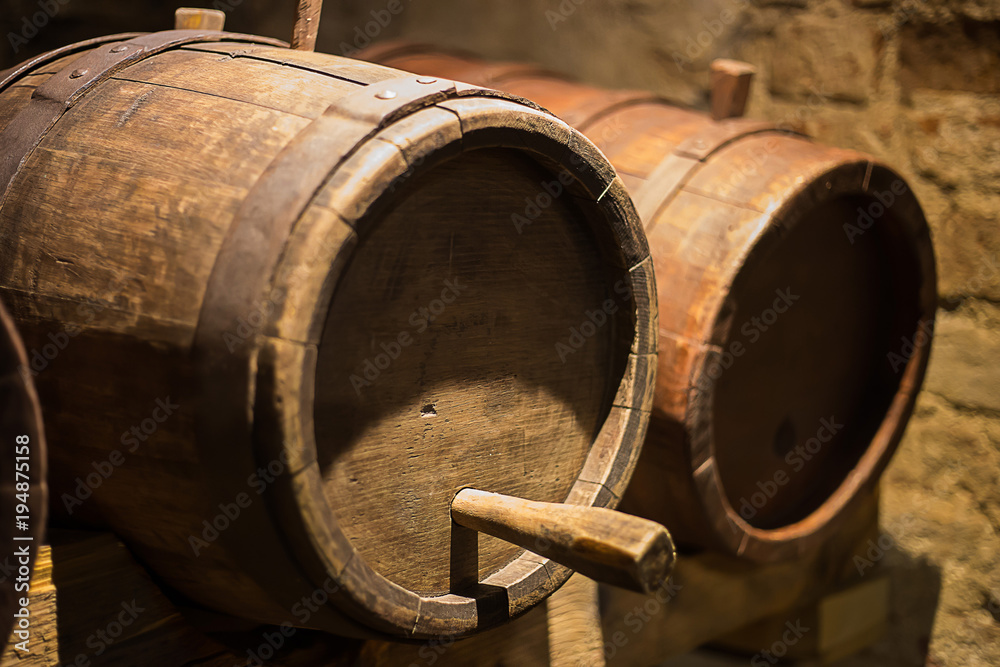 Wine barrels in the a wine cellar Wine barrels in the a wine cellar