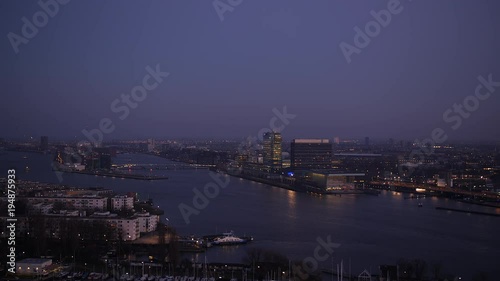 Night view Amsterdam across IJ-river. photo