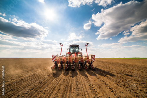 Valokuva Farmer seeding, sowing crops at field