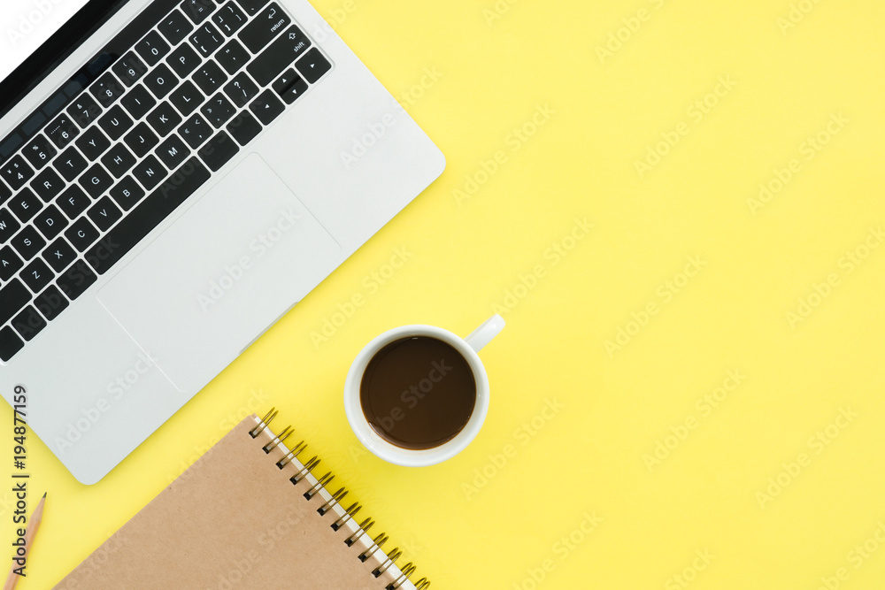 Minimal work space - Creative flat lay photo of workspace desk. Top view office desk with laptop, notebooks and coffee cup on pastel color background. Top view with copy space, flat lay photography. Minimal work space - Creative flat lay photo of workspace desk. Top view office desk with laptop, notebooks and coffee cup on pastel color background. Top view with copy space, flat lay photography.