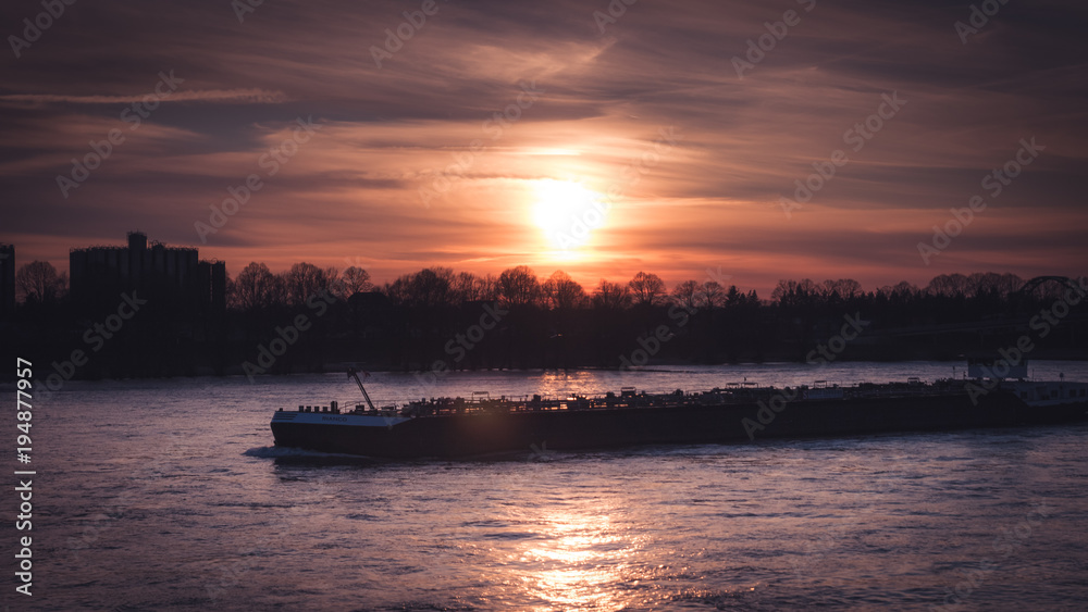 Boat on the rhine in sunset