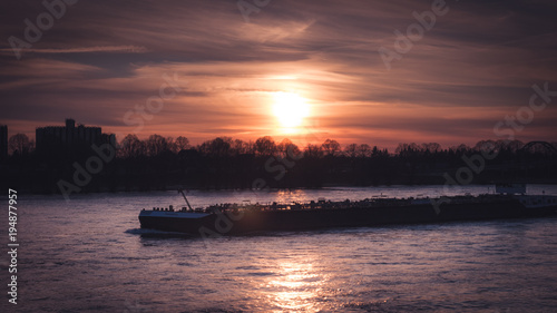 Boat on the rhine in sunset