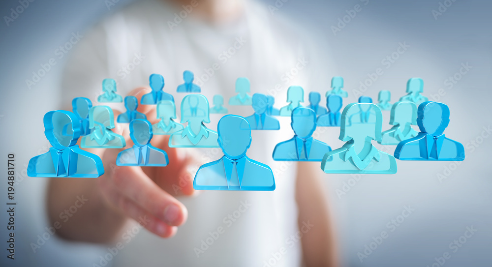 Businessman holding 3D rendering group of blue people Businessman holding 3D rendering group of blue people