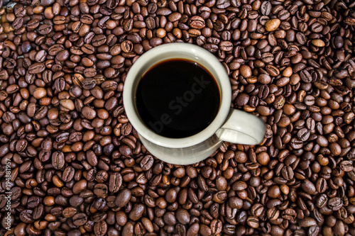 Cup Of Coffee Sitting On A Coffee Bean Background