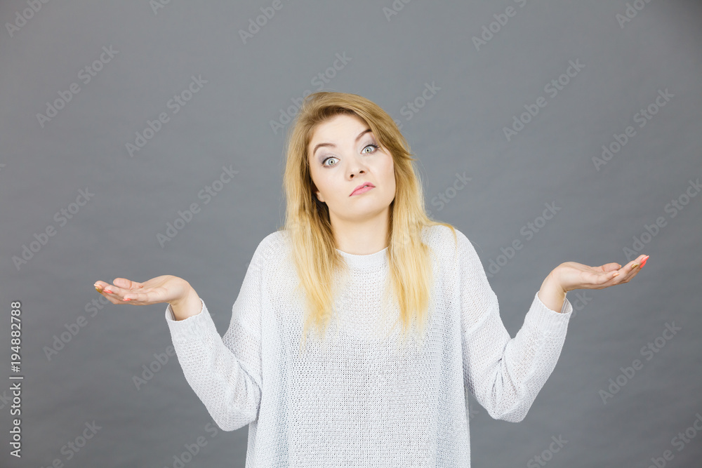 Young woman seek a solution, making undecided gesture Young woman seek a solution, making undecided gesture
