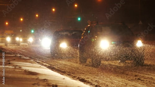 Winter traffic driving in the city, during heavy snow storm. Minsk, Belarus.