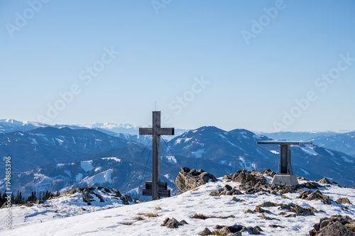 Panoramic snowy landscape scenic view from summit of mountain Rennfeld photo