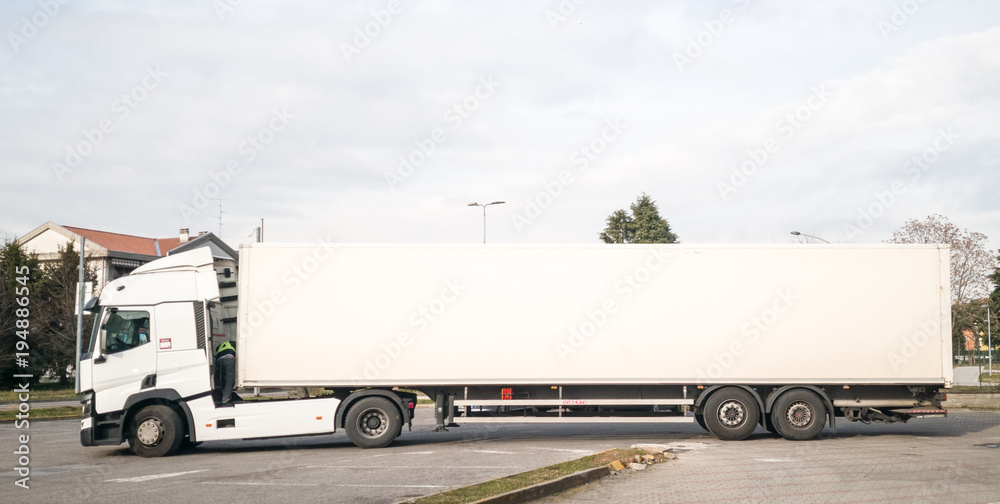 Big truck with a white blank trailer; copy space photo