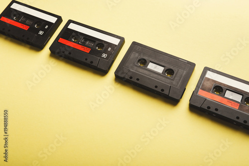 Creative background with audio cassettes of different colors