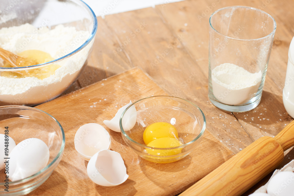 Close view of flour and ingredients for making dough at home Close view of flour and ingredients for making dough at home