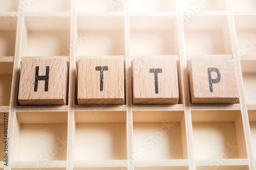 Macro Of The Word HTTP Formed By Wooden Blocks In A Type Case photo