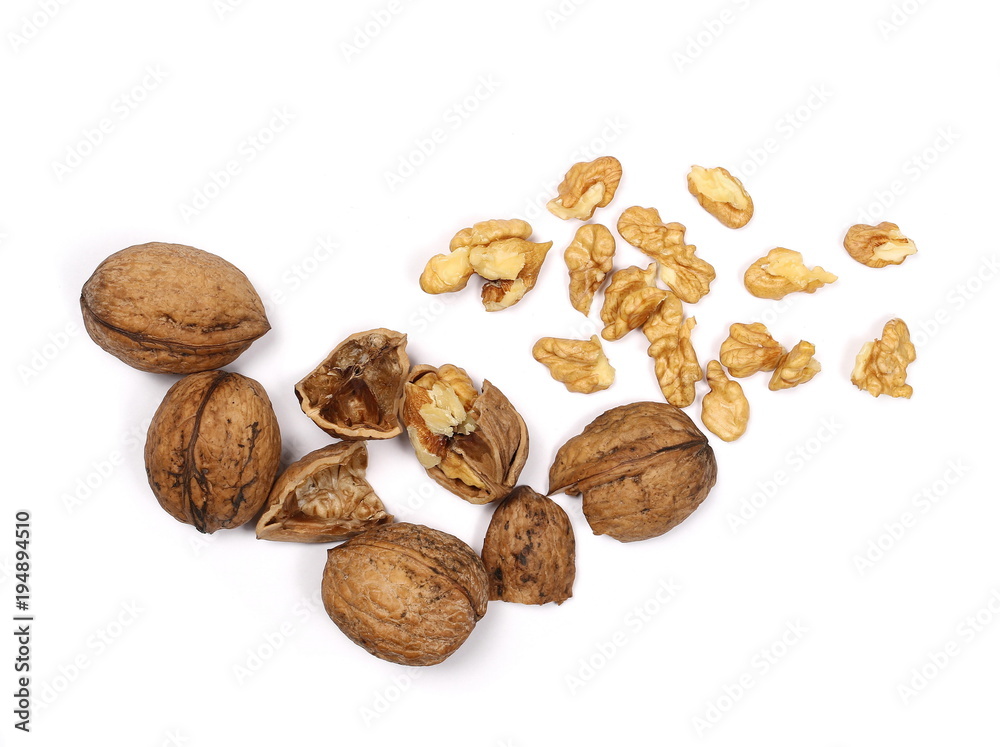 Cracked walnuts isolated on white background, top view Cracked walnuts isolated on white background, top view