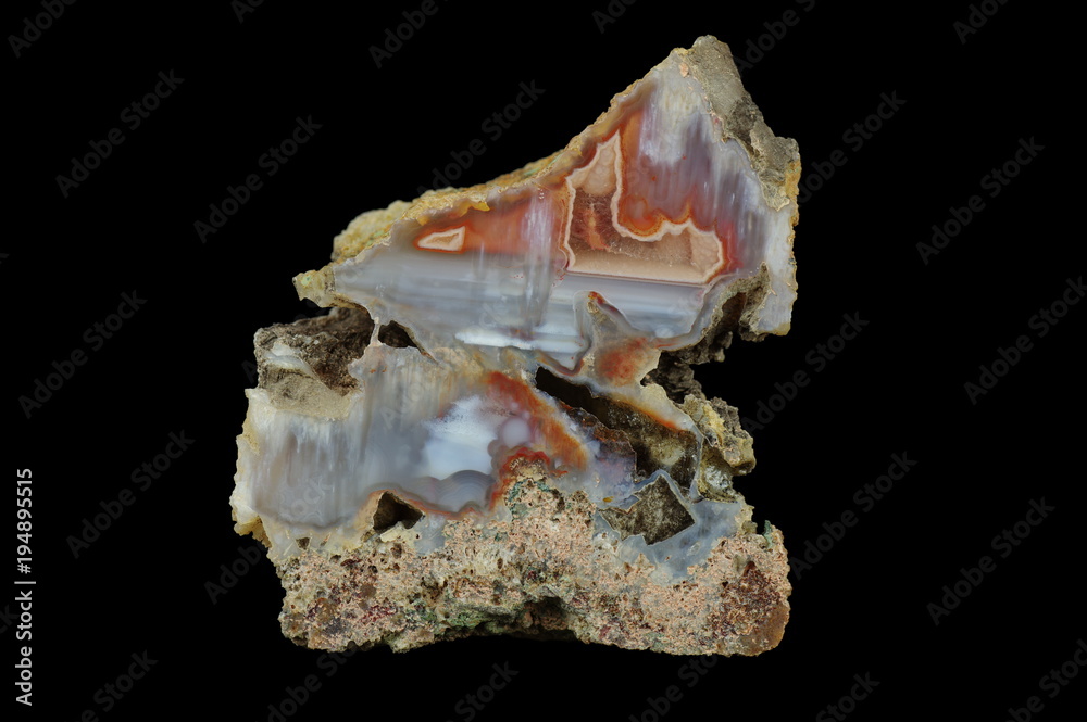 Cross section of the agate. Multicolored silica bands colored with metal oxides are visible. Stalactite agate. Origin: Rudno near Krakow, Poland. Cross section of the agate. Multicolored silica bands colored with metal oxides are visible. Stalactite agate. Origin: Rudno near Krakow, Poland.