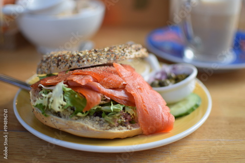 Healthy bagel stuffed with salad and smoked salmon