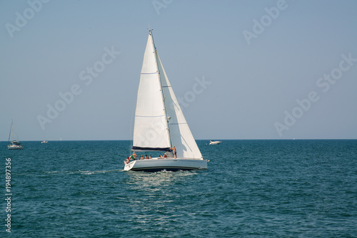 White yacht in the open azure sea near the resort of Rimini  Italy.
