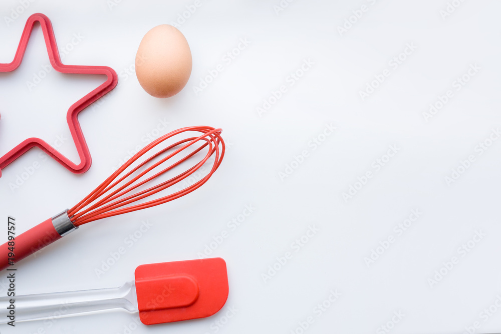 Items for scrambled eggs and omelets, desserts, bakery. Egg, corolla, silicone spatula, silicone mold. The concept of cooking breakfast. Flat lay, copy space, top view. Items for scrambled eggs and omelets, desserts, bakery. Egg, corolla, silicone spatula, silicone mold. The concept of cooking breakfast. Flat lay, copy space, top view.