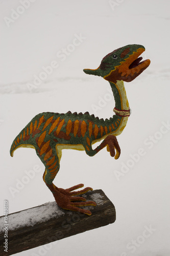 A decorative sculpture of a fantastic theropod. A toy made of Papier-mache. Motley beast. © Piotr