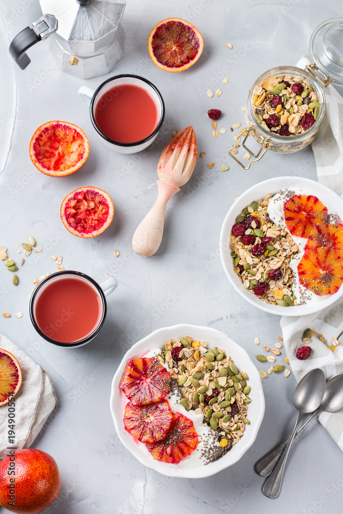 Healthy morning breakfast with granola yogurt blood oranges Healthy morning breakfast with granola yogurt blood oranges