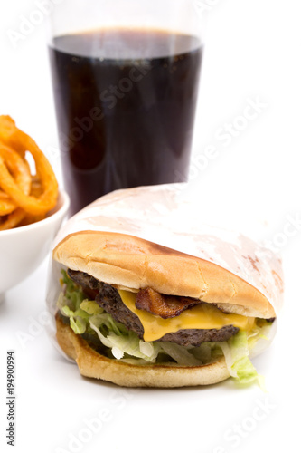 Real Life Hamburger and Seasoned Curly Fries on a White Background
